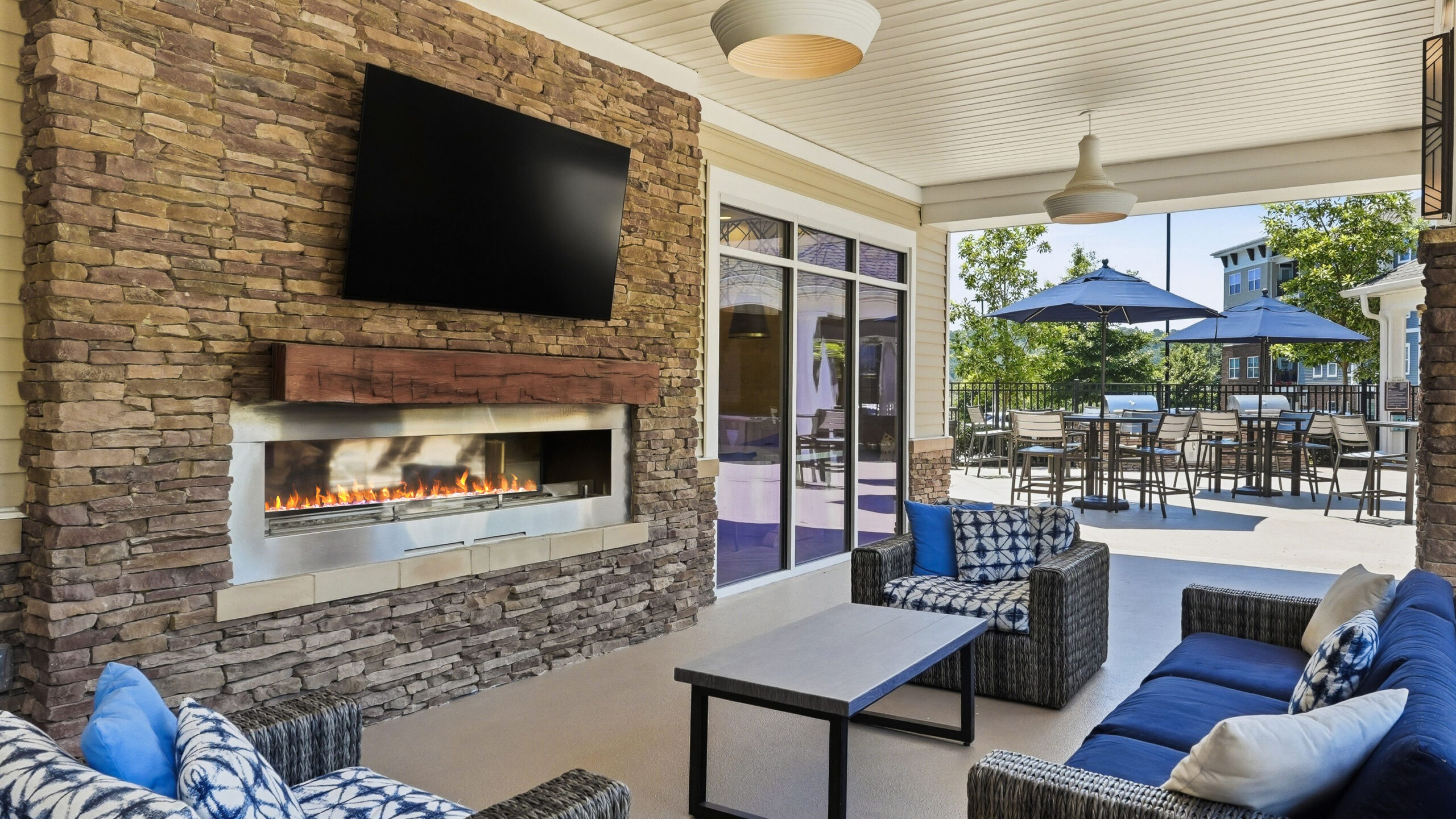 Hawthorne at the Wluxury outdoor pool with in-pool lounge chairs and surrounding seating