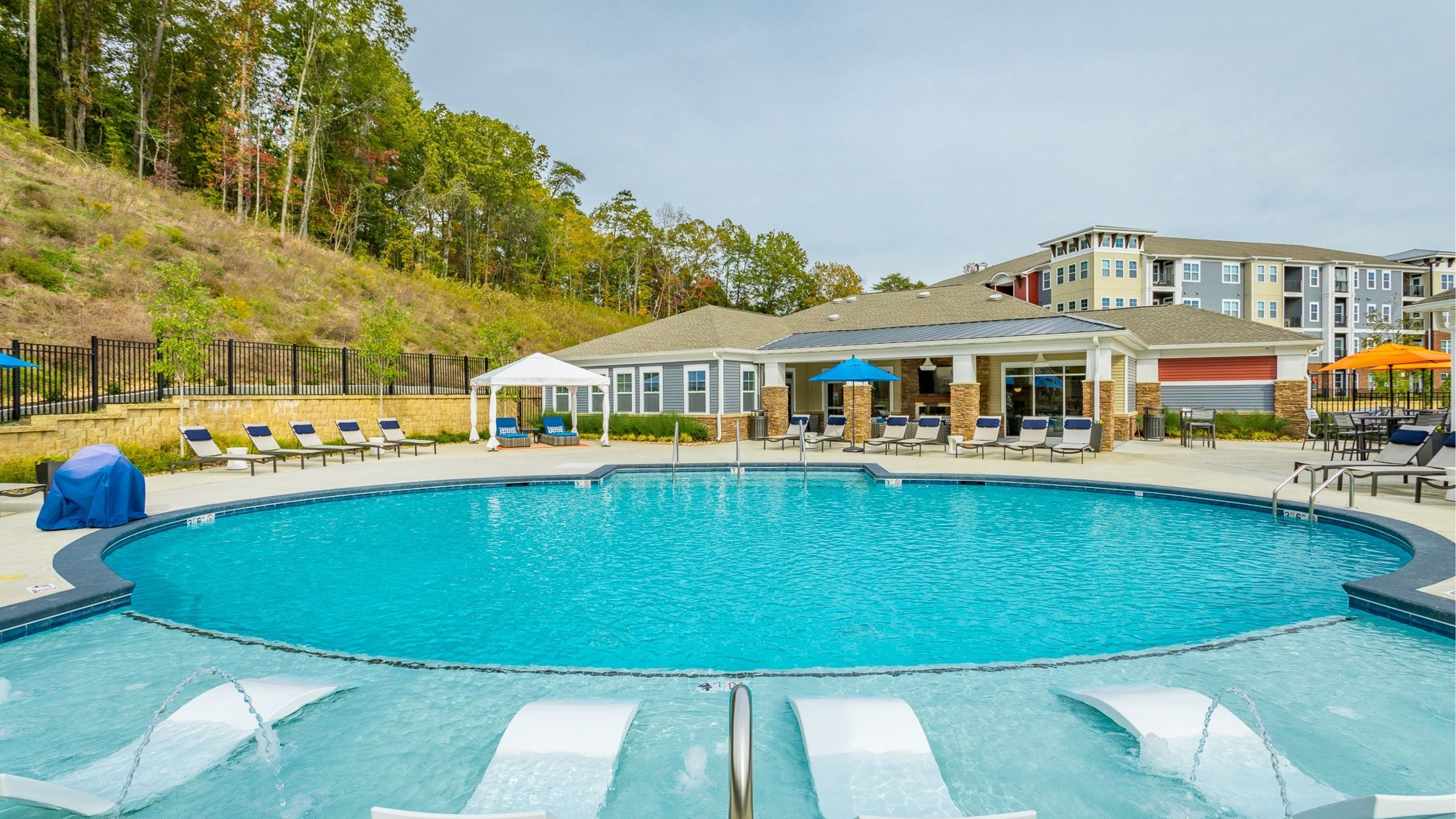 Hawthorne at the W luxury outdoor pool with in-pool lounge chairs and surrounding seating