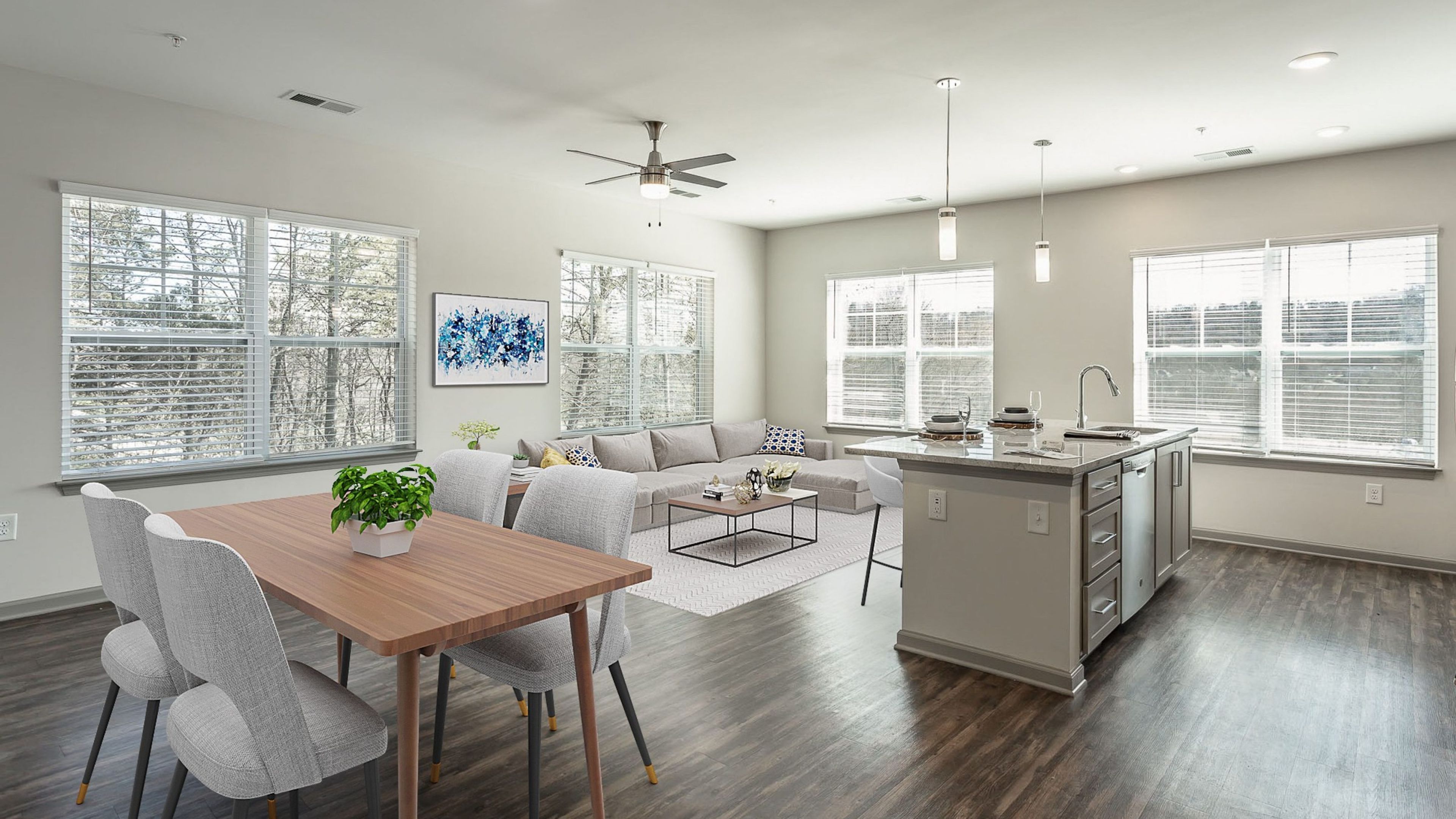 Hawthorne at the W apartment kitchen and living area with granite countertops, stainless steel appliances, and large windows