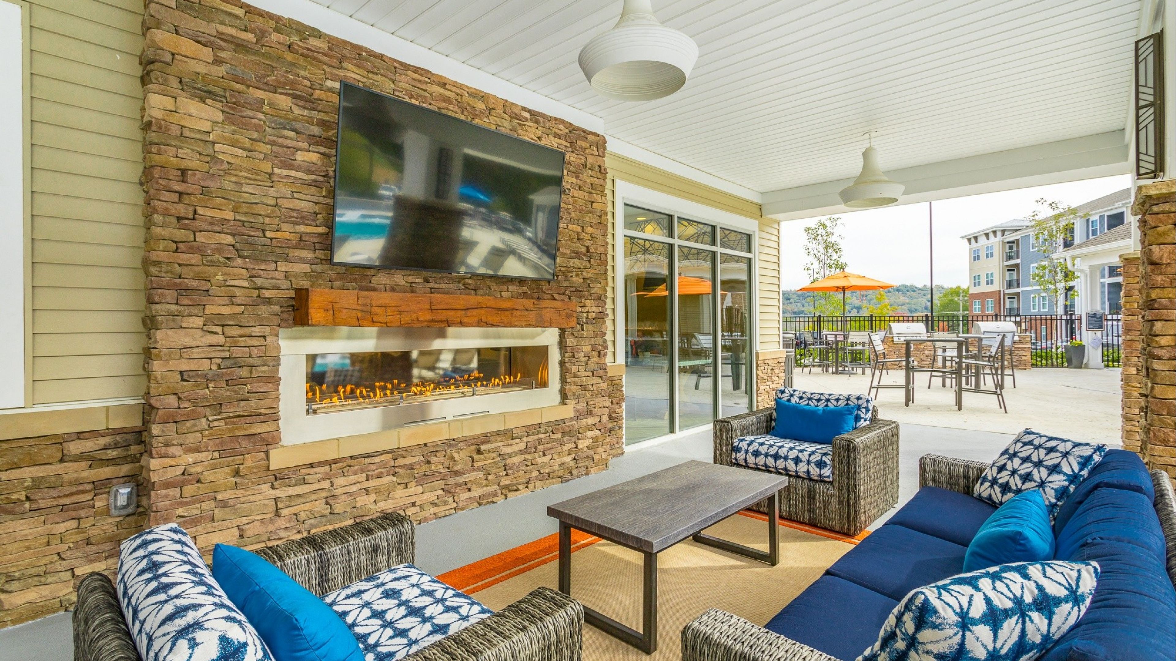 Hawthorne at the W outdoor living room with fireplace and lounge seating