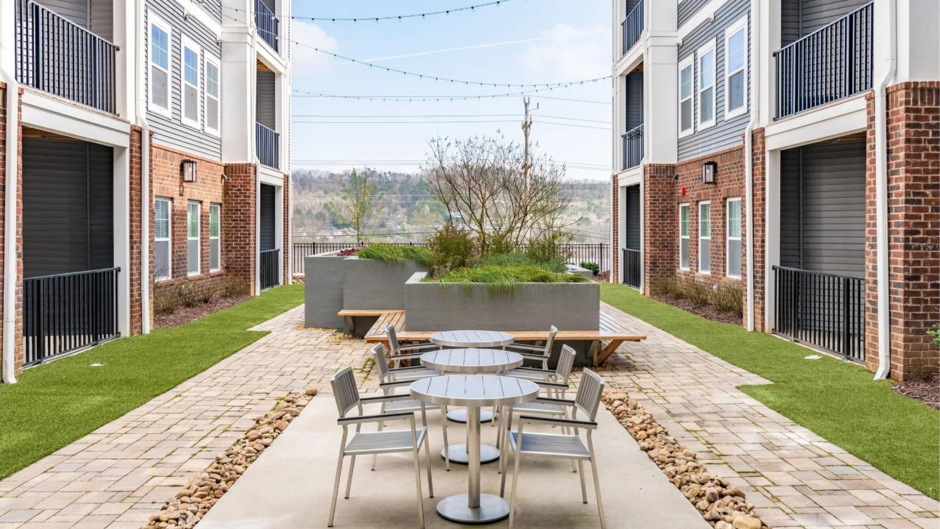 Hawthorne at the W outdoor living room with fireplace and lounge seating