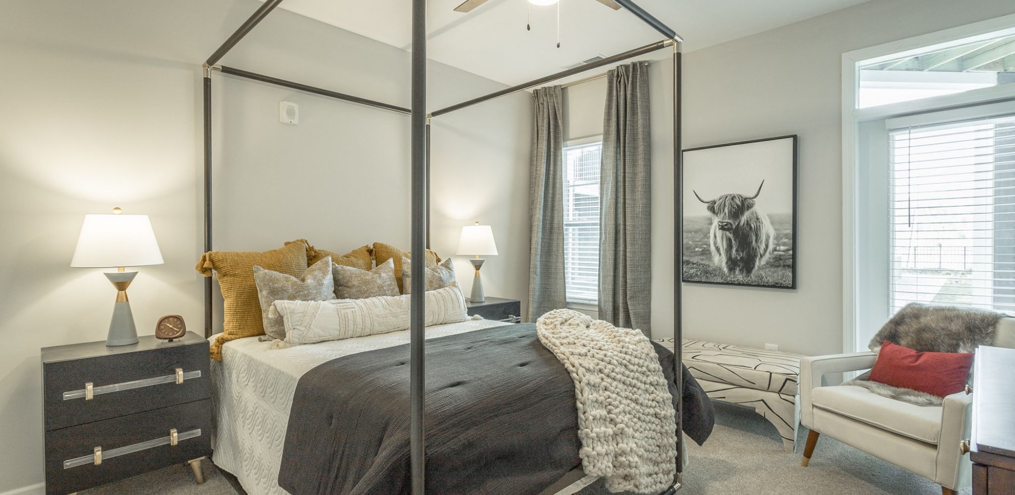 Hawthorne at the W spacious apartment bedroom with balcony access and furnished with large bed