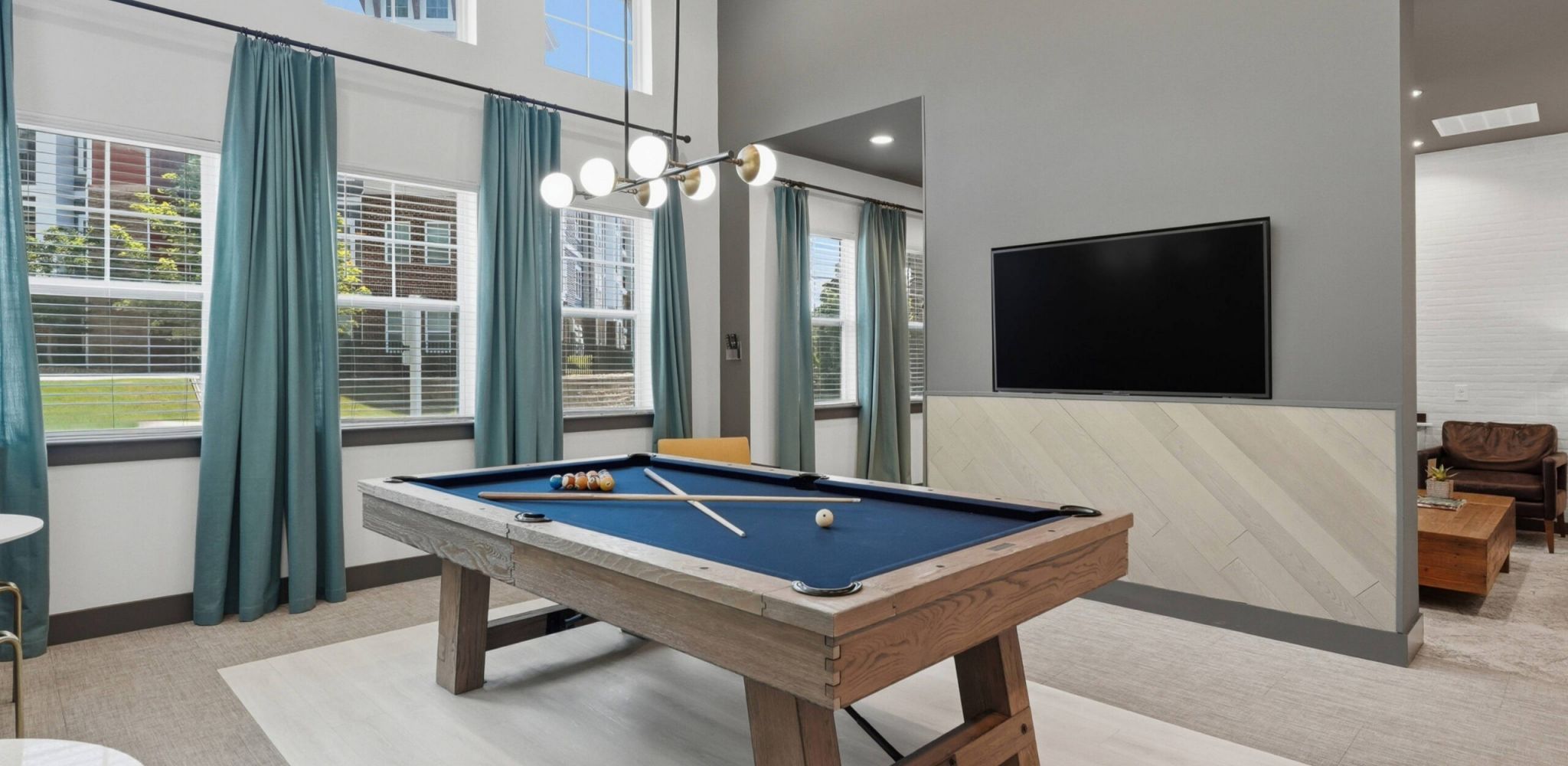 Hawthorne at the W spacious apartment bedroom with balcony access and furnished with large bed